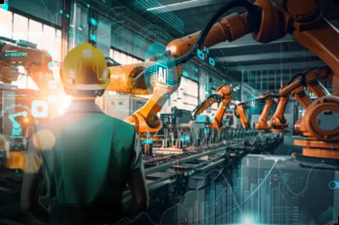 Engineer overseeing robotic arms on a factory line with a computer-vision overlay