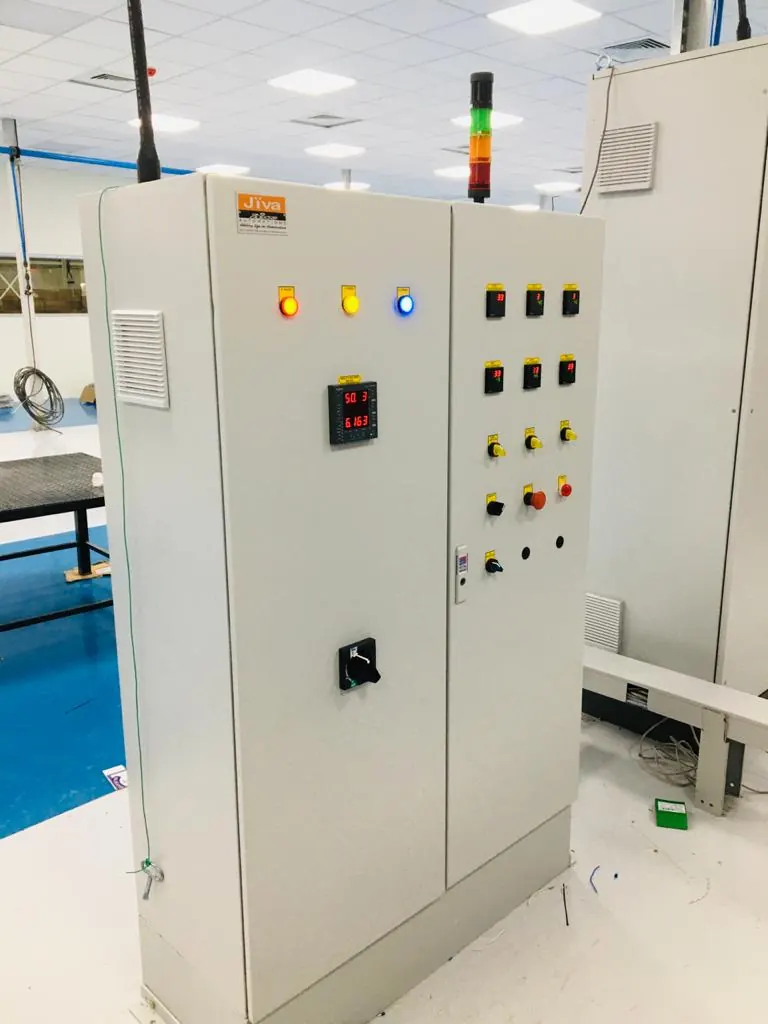 Control panel with indicator lamps, digital meter and a stack light