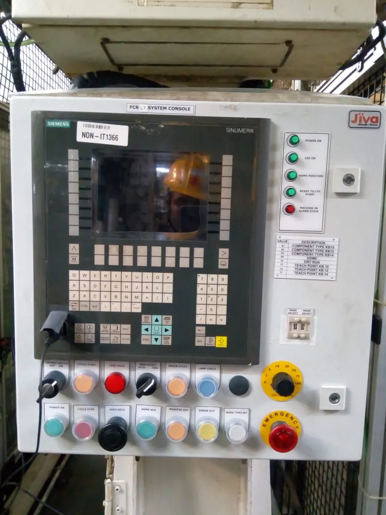 Machine control panel with a Siemens operator interface, selector switches and push buttons