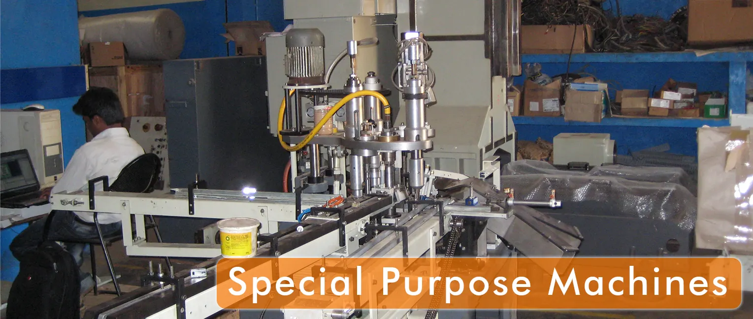 Engineer working beside a special-purpose assembly machine