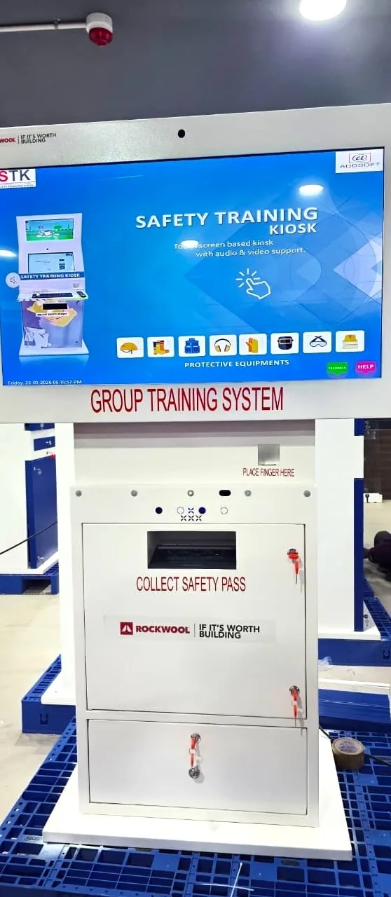 Front view of the ROCKWOOL safety training kiosk with its touchscreen and Collect Safety Pass slot