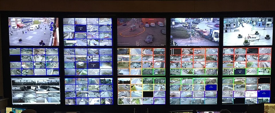 Security control room video wall showing many CCTV feeds