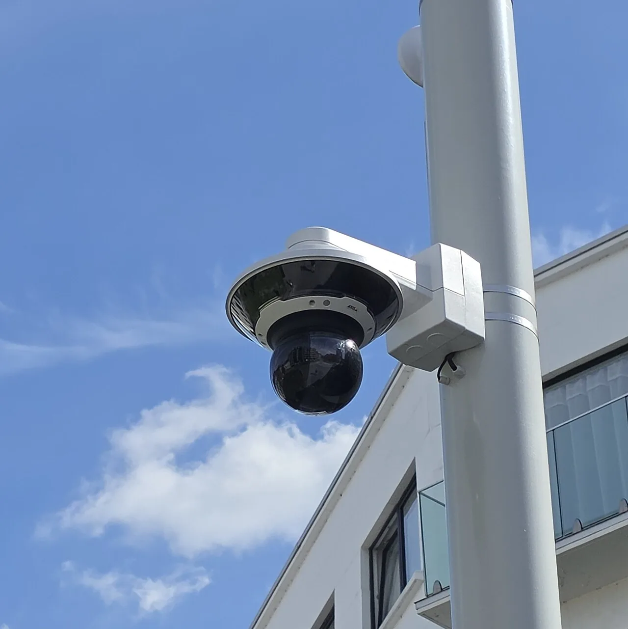 Multi-lens outdoor surveillance camera mounted on a pole