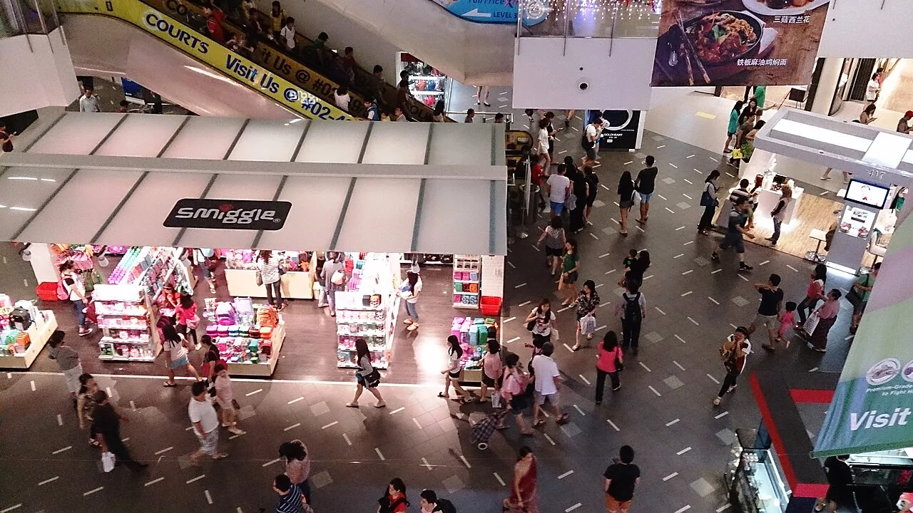 Shoppers crowding the floors of a multi-level shopping centre